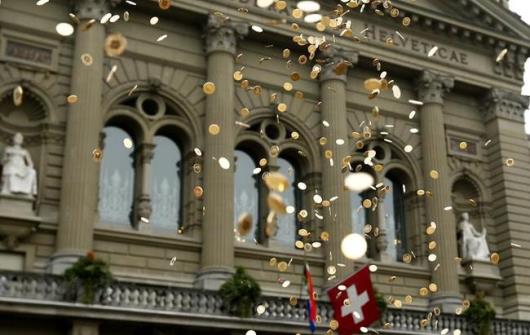 Five Cent Coins Airborne in Front of the Federal Palace, Bern Switzerland During an Event for Pay Equality